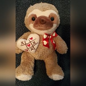 2018 Dan Dee Sloth holding Tic Tac Toe heart pillow.